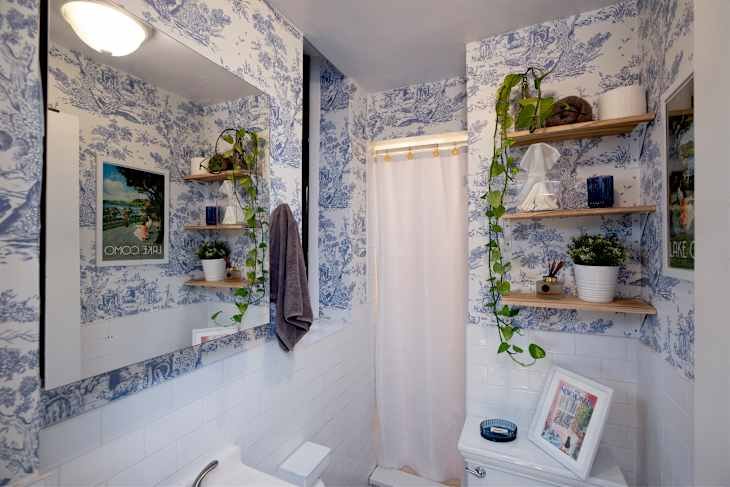 Bathroom with blue and white toile wallpaper